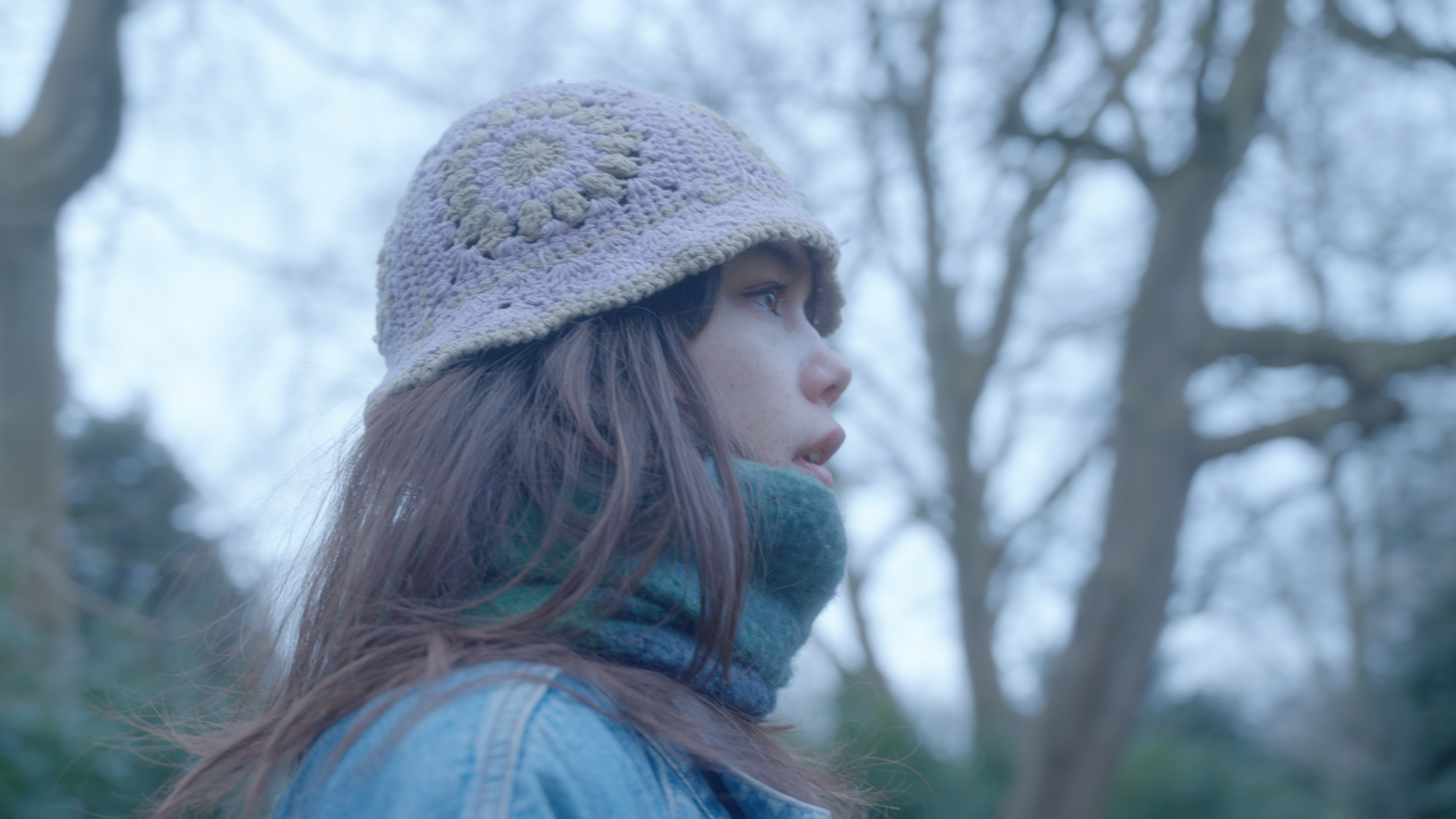 A woman, staring open mouthed into nature.
