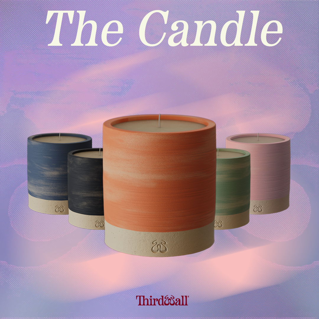 The Candle product picture displaying the range of colours. 1x Mint, 1x Blue, 1x Coral & 1x Charcoal and 1x exclusive Pink version